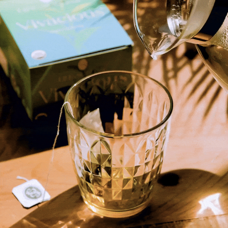 Pouring hot water into organic green tea - Life by Sublime - 1000x1000